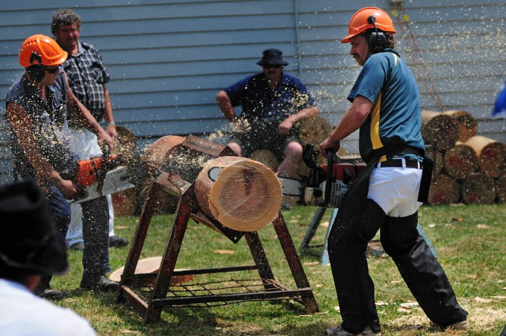 Pluto Burrows, of Ringarooma, and Mick Mayne, of St Helens face off in the chainsaw contest. Picture: Peter Sanders