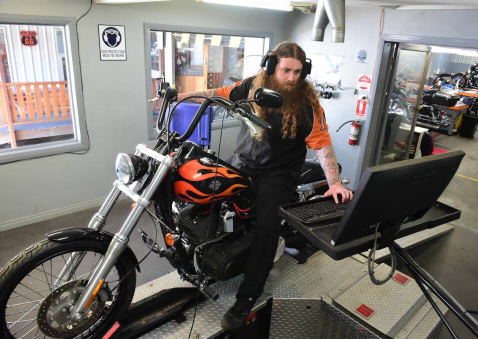 Richardsons Harley Davidson technician Nathan Richmond on a " Wide Glide" on the dyno machine. Picture: Paul Scambler