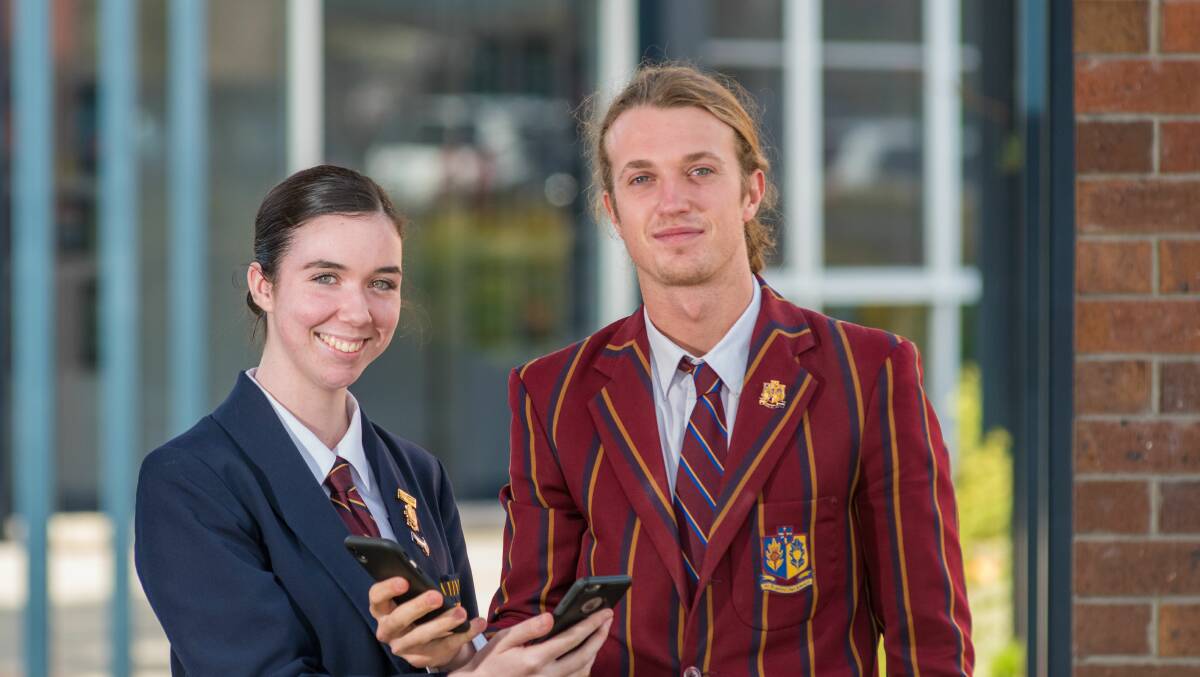 PHONE BAN: Scotch Oakburn year 12 students Lily Fontyn and Ruben McCormack say their school life is better for a mobile phone ban. Picture: Phillip Biggs
