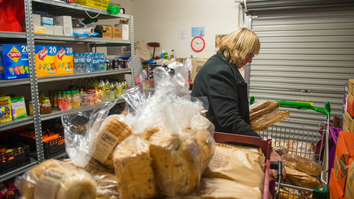 Volunteers man the grocery food room every day at the Salvation Army. It relies on donations of food from the community and corporate partnerships. 