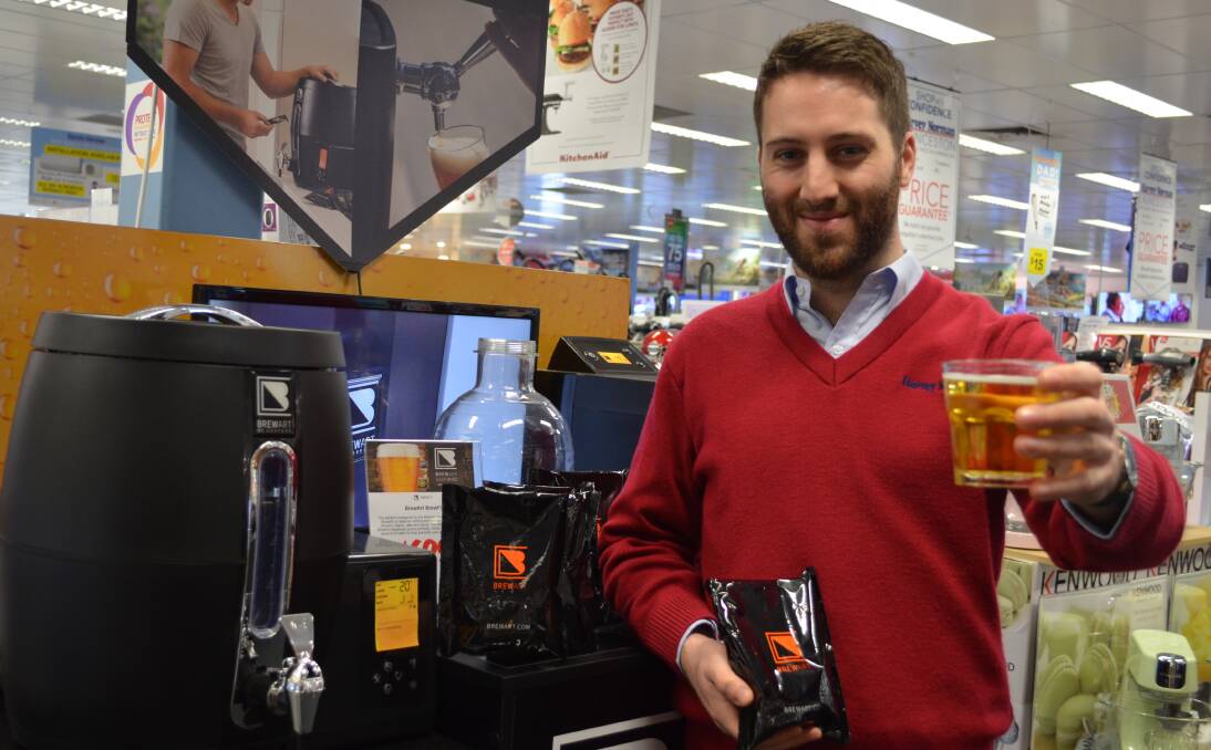 HOME BREWED: Harvey Norman electrical trainee franchisee Nick Heaney is the full bottle on the new BrewArt beer brewing system now available exclusively to Harvey Norman.