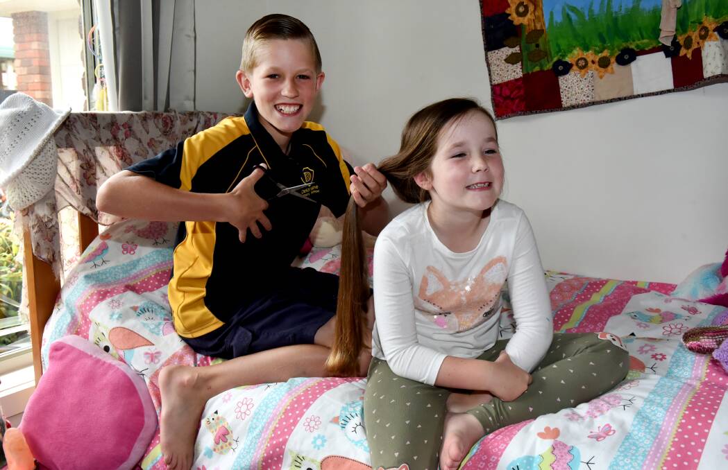 SNIP SNIP: Deloraine Primary School pupil Meah Steer with brother Shane Steer, 10. Picture: Neil Richardson.