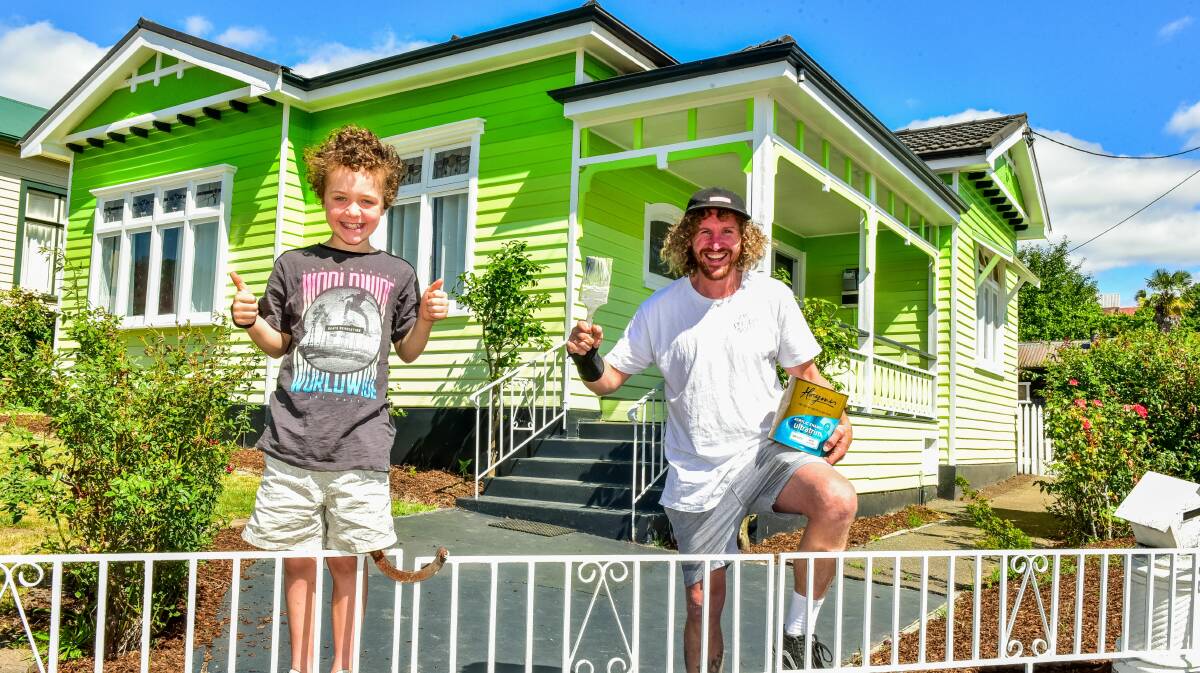 GOING GREEN ALL OVER: Painter Robert Gilligan, with his cousin Flynn Turner, outside his ombre green house. Picture: Neil Richardson