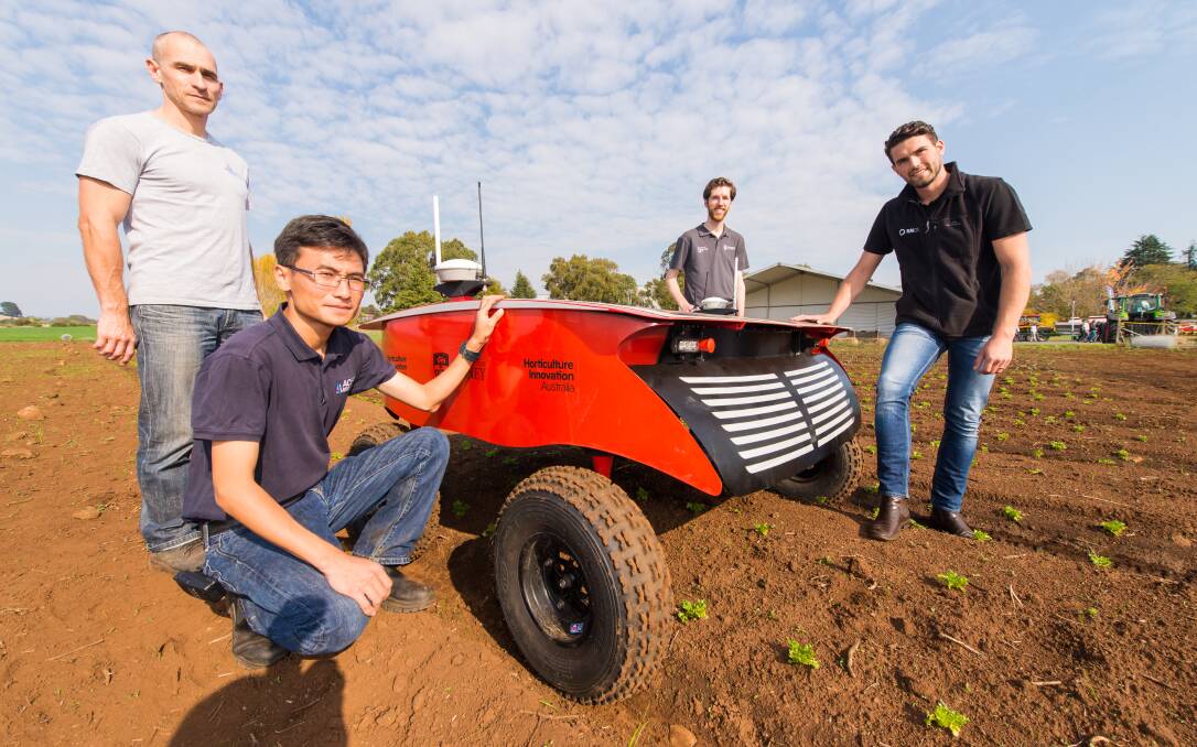 FUTURE FARMING: Engineer Vsevolod Vlaskine, research fellow Zhe Xu, engineer Justin Clarke and science communication consultant Carl Larsen with RIPPA at TAPG expo, Deloraine. Picture: Phillip Biggs