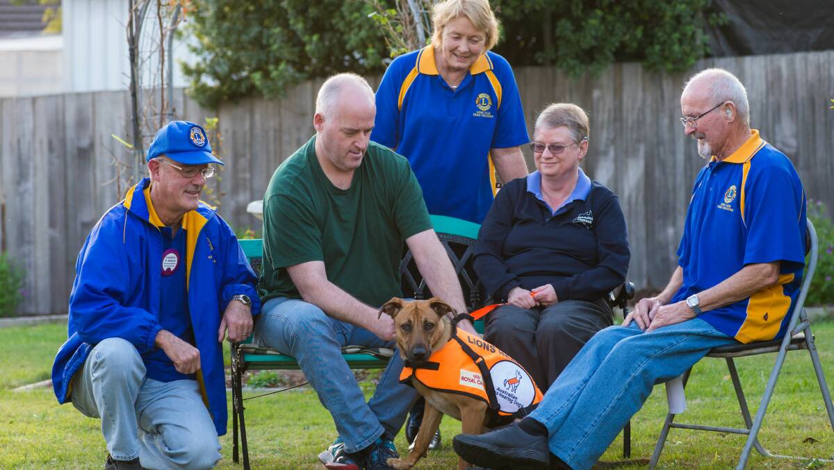 HAVE YOU HEARD ABOUT MAX? Simon and Carol Brown with Max, their hearing dog, and Kings Meadows Lions club members Darrell Atkinson, Angela Hughes-Martin, Derek Fellows. Picture: Phillip Biggs