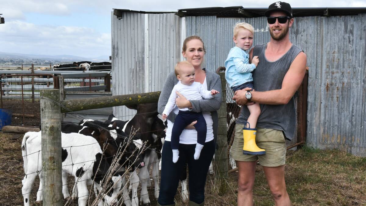 POSITIVE FOR NEXT SEASON: Legana dairy farmers Joe and Tamara Hammond with with their children Hayley and George. Picture: Neil Richardson