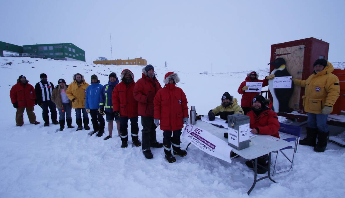 Democracy in thermals: Staff at the Australian Antarctic Division line up to cast their votes at the most souther polling place this fedreal election. Picture: Aaron Stanley/Australian Antarctic Division