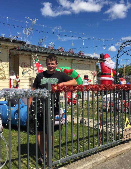 LIGHTING THE NIGHT: Ashley Bowerman decorates his family home in Christmas lights. It takes three months to set them all up. Picture: Tarlia Jordan