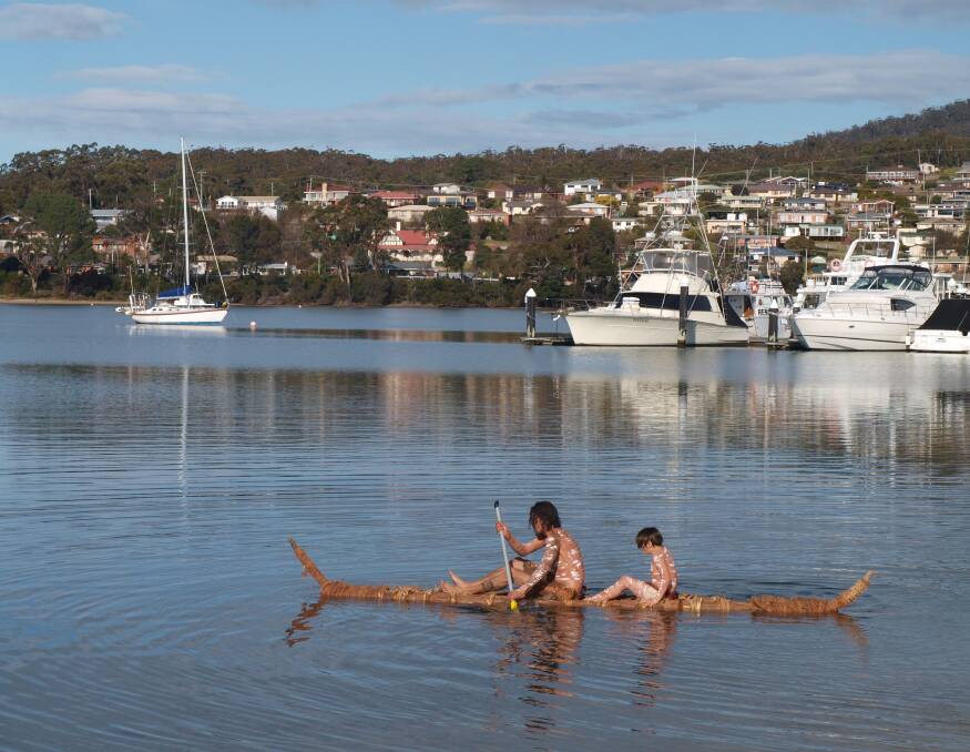 FLOATING: St Helens District High School pulled together to build a canoe out of reeds and bark to celebrate NAIDOC Week. The canoe was launched on Friday at the St Helens Foreshore. Picture: supplied.