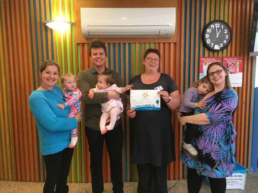 AWARDED: Laura Priestley with Indie Williams, Stewart Bell with Alana Priestley, Susannah Koch, and Sara Davis with Eleanor Davis, after the Beaconsfield Child and Family Centre received recognition of its facilities. Picture: supplied. 
