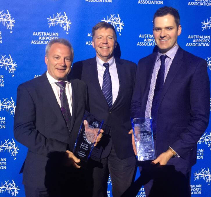 WINNERS: Launceston Airport's Paul Hodgen, Peter Holmes and Michael Cullen collect the two awards at Parliament House. Picture: Supplied.