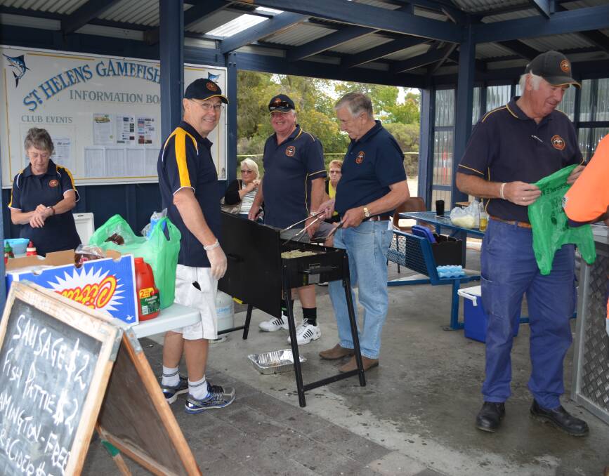 SAUSAGES SIZZLE: St Helens Marine Rescue cook up the barbecue at last year's Australia Day celebrations. Picture: Supplied