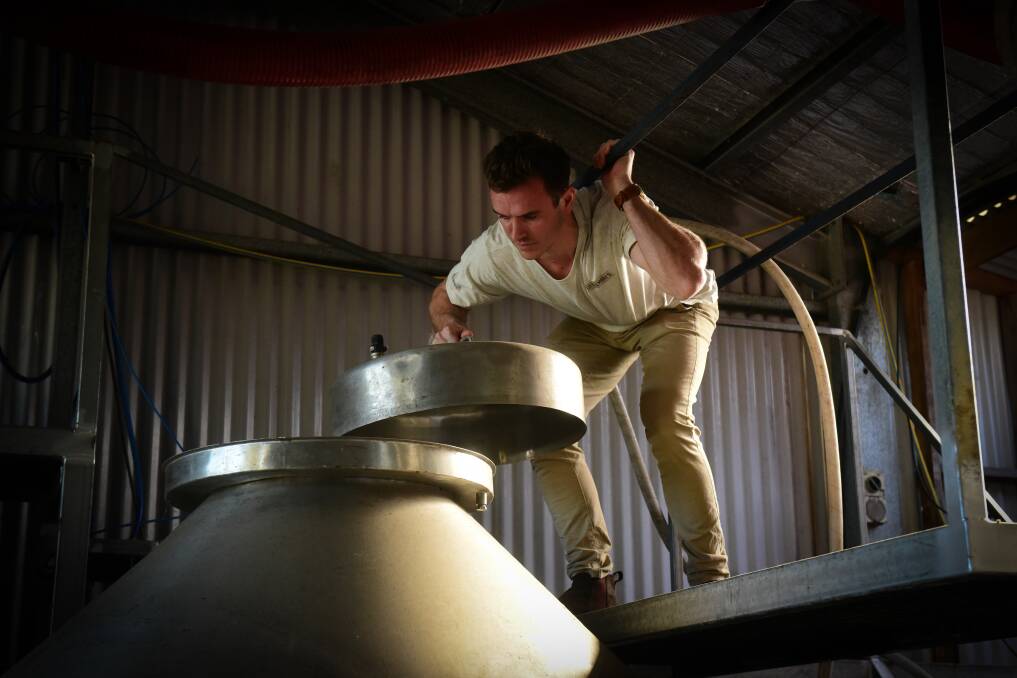 INSPECTING: Harry Miller makes sure Little Mary's Cider is brewing properly. Picture: Paul Scambler. 