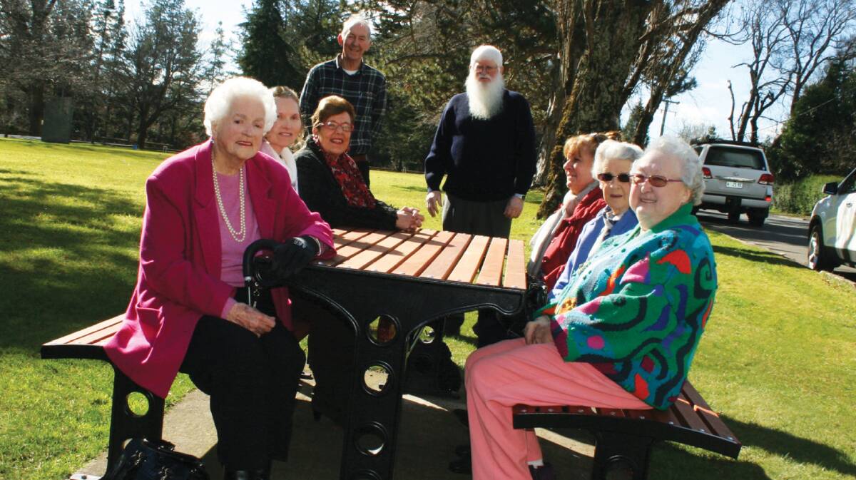 RESTING: Phyllis Ingamells, Eve Taylor, Judy Barton, Barry Lee, Councillor Bob Richardson, Debbie Bailey, Gwen Harris and Barbara Jardine enjoy the new seating installed on the Westbury Village Green. Picture: supplied