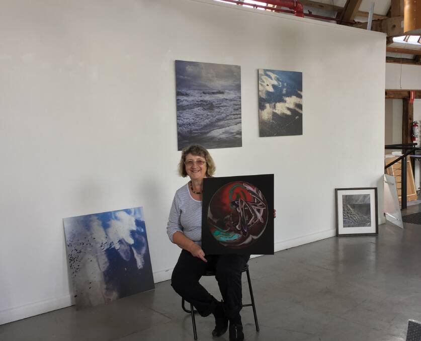 Artist Anne O'Connor plans out the placement of her works for her upcoming exhibition called Light Talks at Stillwater Gallery. Picture: Tarlia Jordan