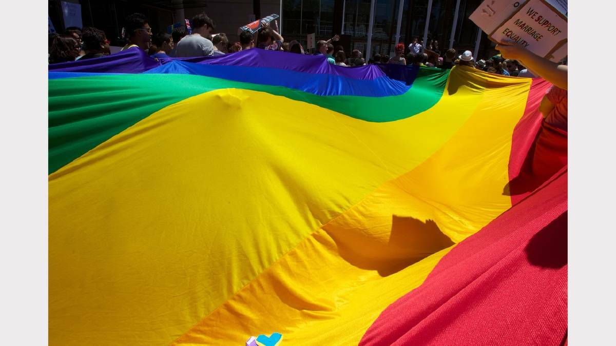 Marriage equality flag motion unfurls