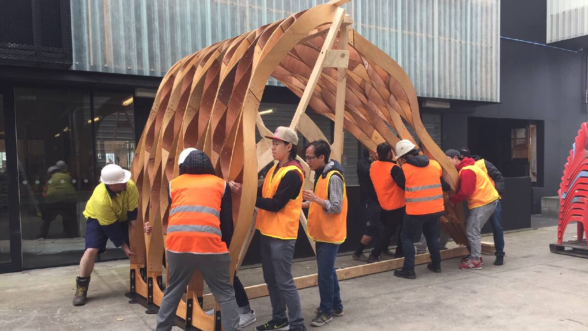 ENTRY: Students prepare to attach part of the structure to the crane. Picture: Tarlia Jordan