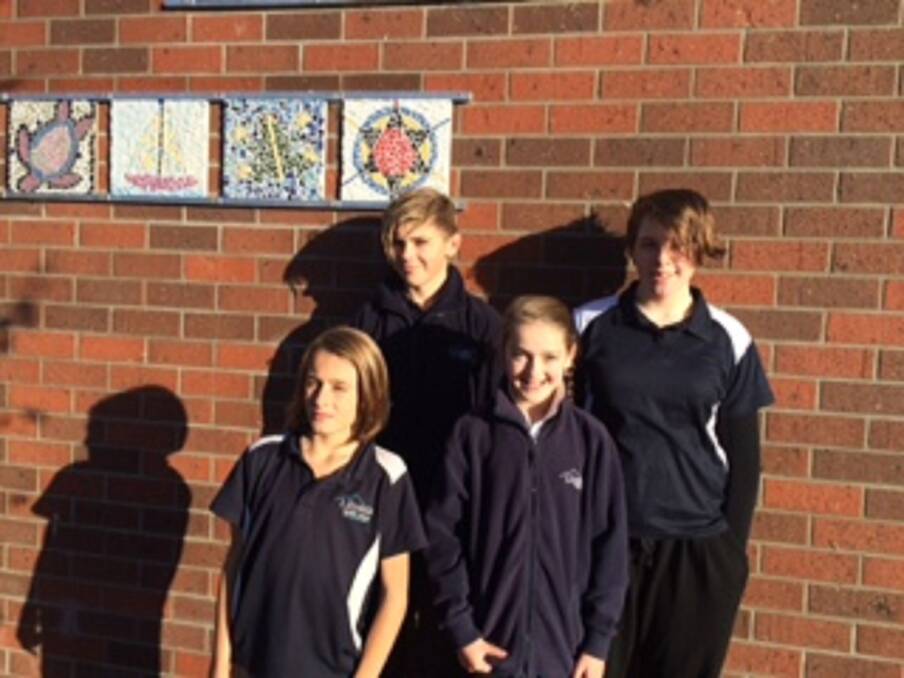 WELCOMING: Program participants Vincent Weinreich, Bree Howard, Rafferty Arundel-Clark and Cailey Farrell with the new mosaic tiles at Lilydale District School. Picture: supplied. 