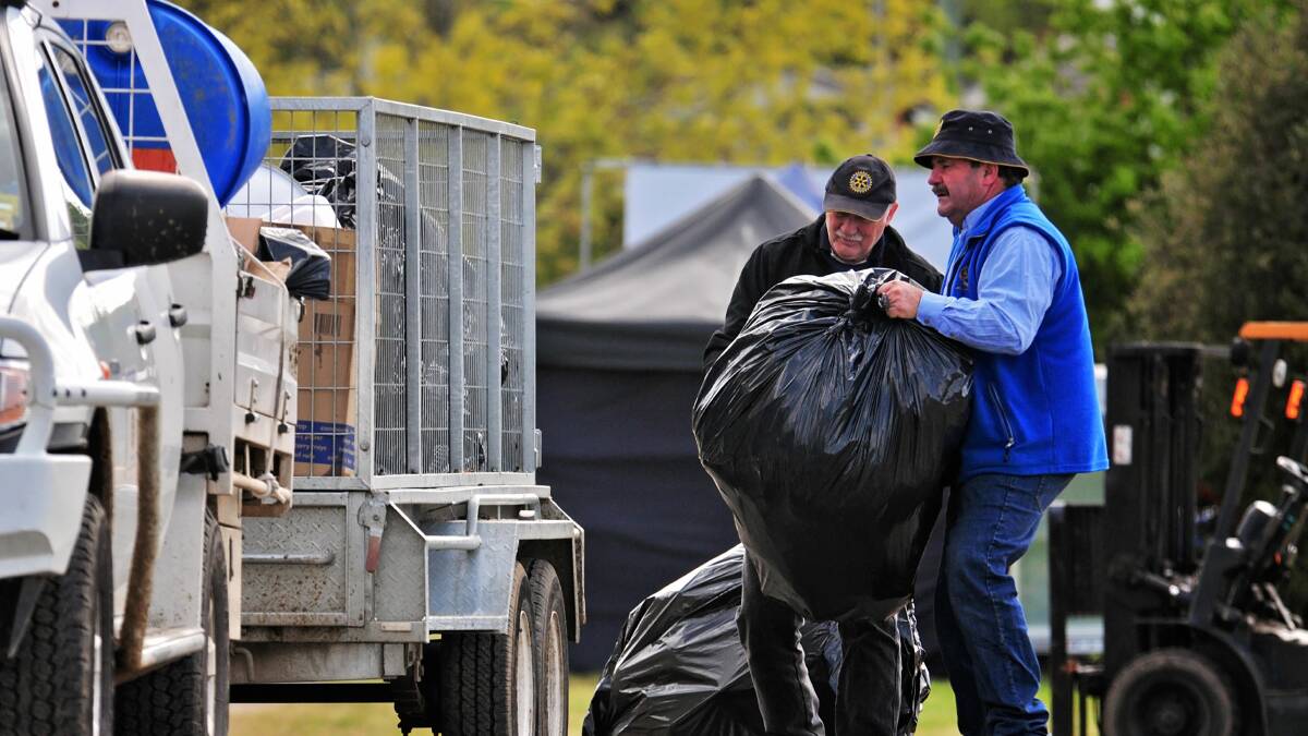 Rotary Club of Latrobe volunteers John Blackwell and Peter Peter Broun spent a day removing rubbish from the Deloraine craft fair. Picture: Phillip Biggs