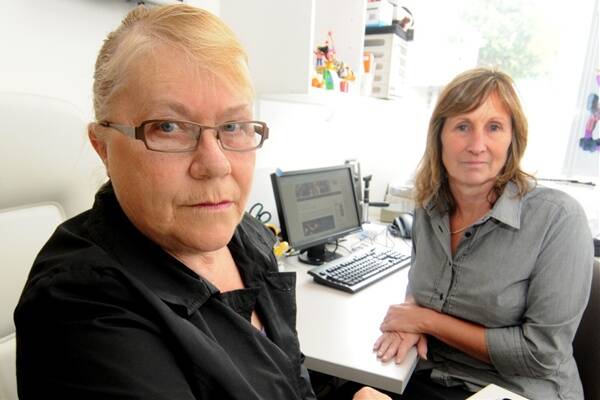 Karen Bishop, of Ravenswood, and Eye Institute practice manager Jennie Rossetto. It is estimated Ms Bishop will have to wait two years for cataract surgery because of cuts.  Picture: GEOFF ROBSON