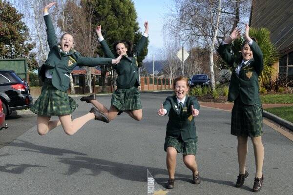 St Patrick's College students Kareen Duffy, 17, Kiandra Trickett, 17, Chelsea Davis, 18, and Stephanie King, 18, celebrate their Rock Eisteddfod Challenge awards.  Picture: PAUL SCAMBLER