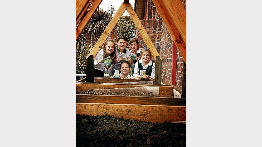 East Launceston Primary School grade 2 pupils Molly Flanagan, Jacoby Casboult, Chloe Ransom, Ella Gunsar and Sarah North are planting and monitoring vegetable growth. Picture: ZONA BLACK