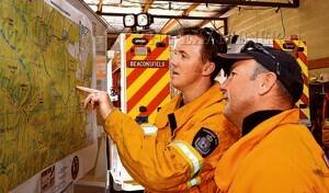 Field works officer Ben Wilson and Beaconsfield brigade chief Tim Williams assess the fire's progress.