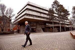 Launceston MLC Don Wing strolls past Henty House, which has been described as Launceston's ugliest building. Picture: WILL SWAN