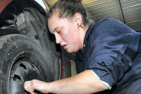 Students shift a gear to vocational engine room