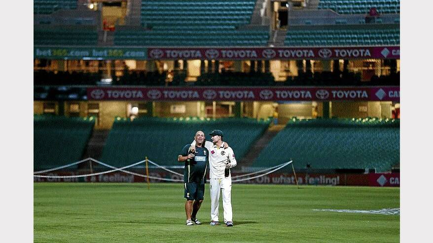 Australian coach Darren Lehmann and Australian captain Michael Clarke celebrate their Ashes success well into the night on the SCG after the fifth Test. Picture: Getty Images