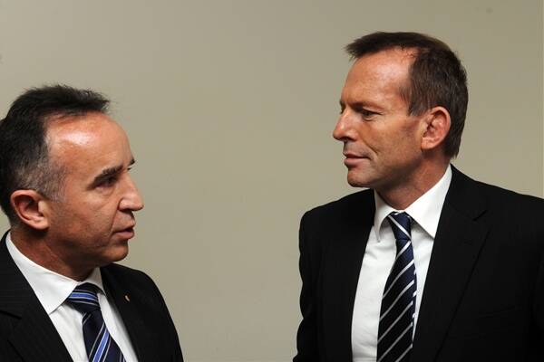 Liberal Bass candidate Andrew Nikolic (pictured with opposition leader Tony Abbott) is in front for Bass according to an exclusive EMRS poll.