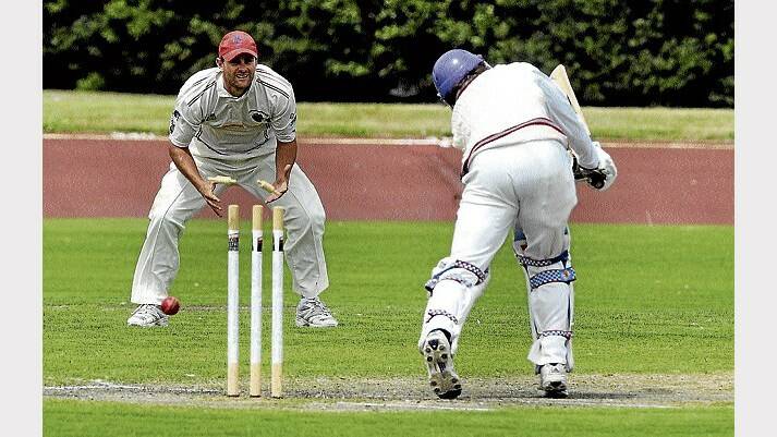Burnie's Brent Munday is bowled by Latrobe's Michael Bishop in yesterday's Cricket North West action. Picture: NEIL RICHARDSON.
