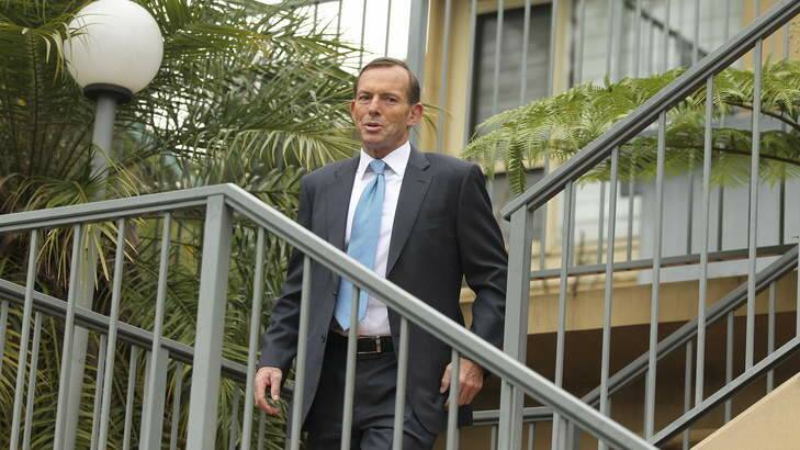 Prime Minister elect Tony Abbott leaves his home the morning after. Photo: Kate Geraghty.
