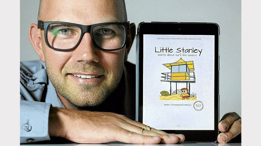 Author-illustrator Michael Bernacki, of the Gold Coast, with one of his new e-books. Picture: PAUL SCAMBLER