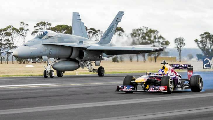 Mismatch: Red Bull's Daniel Ricciardo has compared his incredible day job to that of a Royal Australian Air Force Pilot with a run around at a regional Air Force Base. Photo: Supplied