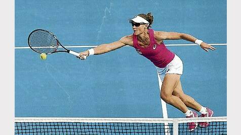 Australian Samantha Stosur plays a forehand volley on her way to a close victory against US player Madison Brengle at the Hobart International yesterday. Picture: GETTY IMAGES