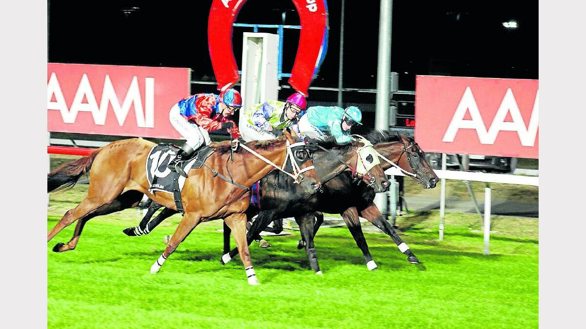 Rebel Bride (centre) is edged out by Beautiful Buns (outside) with Tariana (rails) a close third in last year's Vamos Stakes at Mowbray. Rebel Bride will contest the race again tomorrow night. Picture: TASRACING