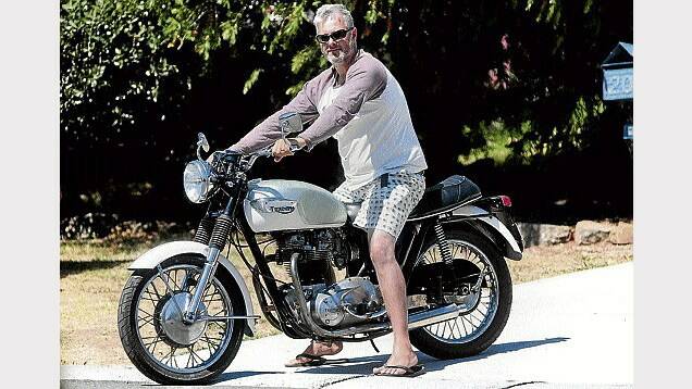 Carl Britton, of West Launceston, with the Triumph he will exhibit at Sunday's Everything Motorcycles Swap Meet and show and shine at Archers Manor.