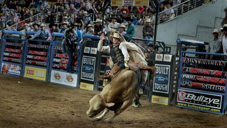 John Crasti bull riding at a rodeo in Tamworth.