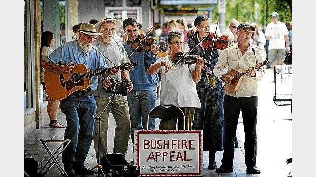 Bushfire fund-raising buskers Kerry Cantlay, of Meander, Michael Manhire, of Perth, Michael Horton, of Launceston, Beth Sauter, of Legana, Louisa Cantlay, of Meander, Cyril Johnson of Hadspen, in the Brisbane Street Mall, Launceston. Picture: PHILLIP BIGGS