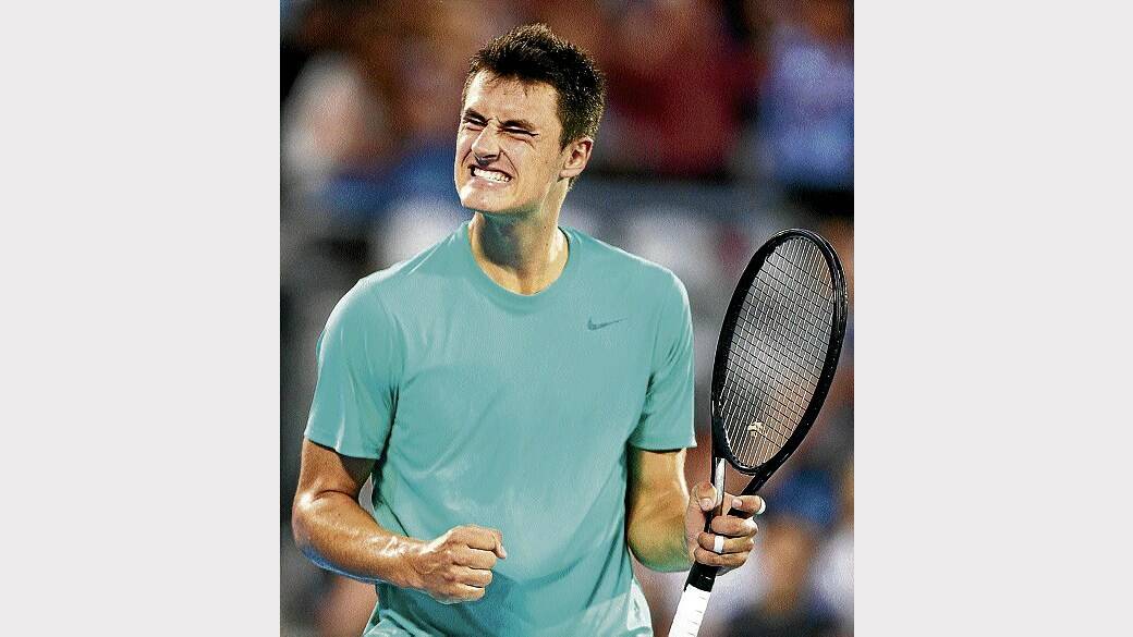 Australia's Bernard Tomic reacts after breaking serve against defending champion Jarkko Nieminen in the Sydney International last night. Picture: GETTY IMAGES