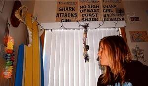 Hannah Mighall with memorabilia of her shark attack survival.