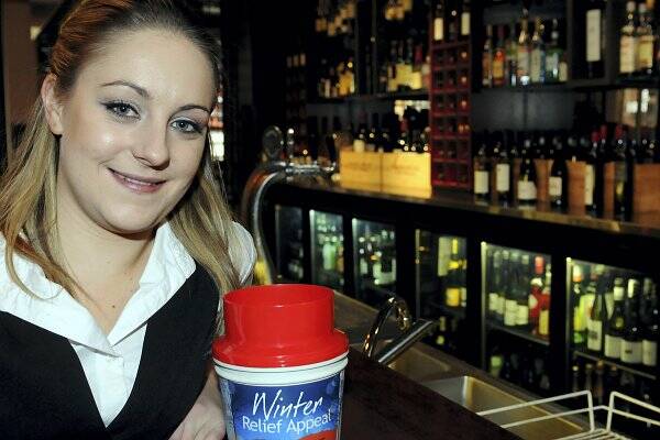 Sarah Willis, of Pierre's Brasserie, prepares a Winter Relief Appeal tin. Picture: GEOFF ROBSON
