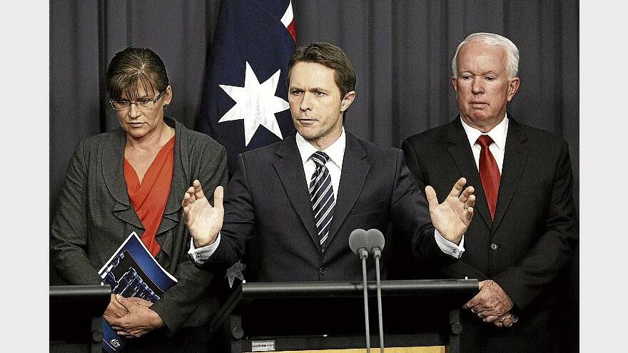 Sports Minister Kate Lundy, Justice Minister Jason Clare and Australian Crime Commission chief executive officer John Lawler speak to the media at Parliament House in Canberra, yesterday. Picture: GETTY IMAGES