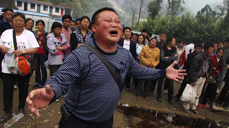 Grieving: A man weeps for his child who was killed when the Beichan middle school collapsed during the 2008 earthquake. Photo: AP Photo/Ng Han Guan