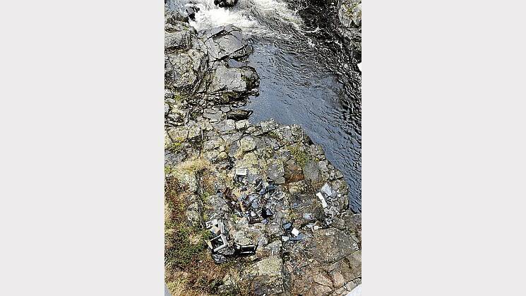 Rubbish on the bank of the North Esk, under the bridge at Corra Linn. Picture: PAUL SCAMBLER
