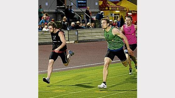 Wynyard's Jorden Englund and Victorian Simon Fitzpatrick hit the line in the 200m final at Devonport on Monday night. They are tipped to be strong chances in today's Burnie Gift. Picture: PHILLIP BIGGS.
