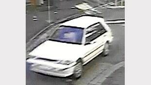 Police are calling for help to identify the driver of this white sedan.