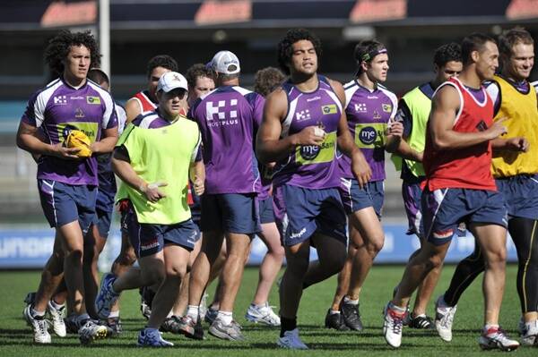 Melbourne Storm players train yesterday.
