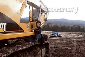 A supplied image of a Code Green protester chained to earth-moving machinery at the Gunns pulp mill site.